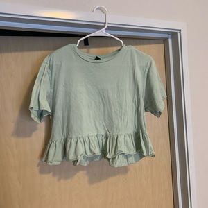 mint green shirt